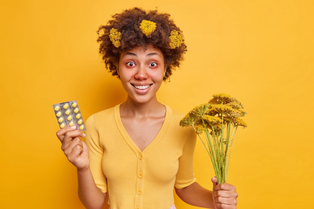 woman finally found way out bought effective pills seasonal allergy being allergic pollen holds bouquet wild flowers has red swollen eyes isolated yellow wall – nagy